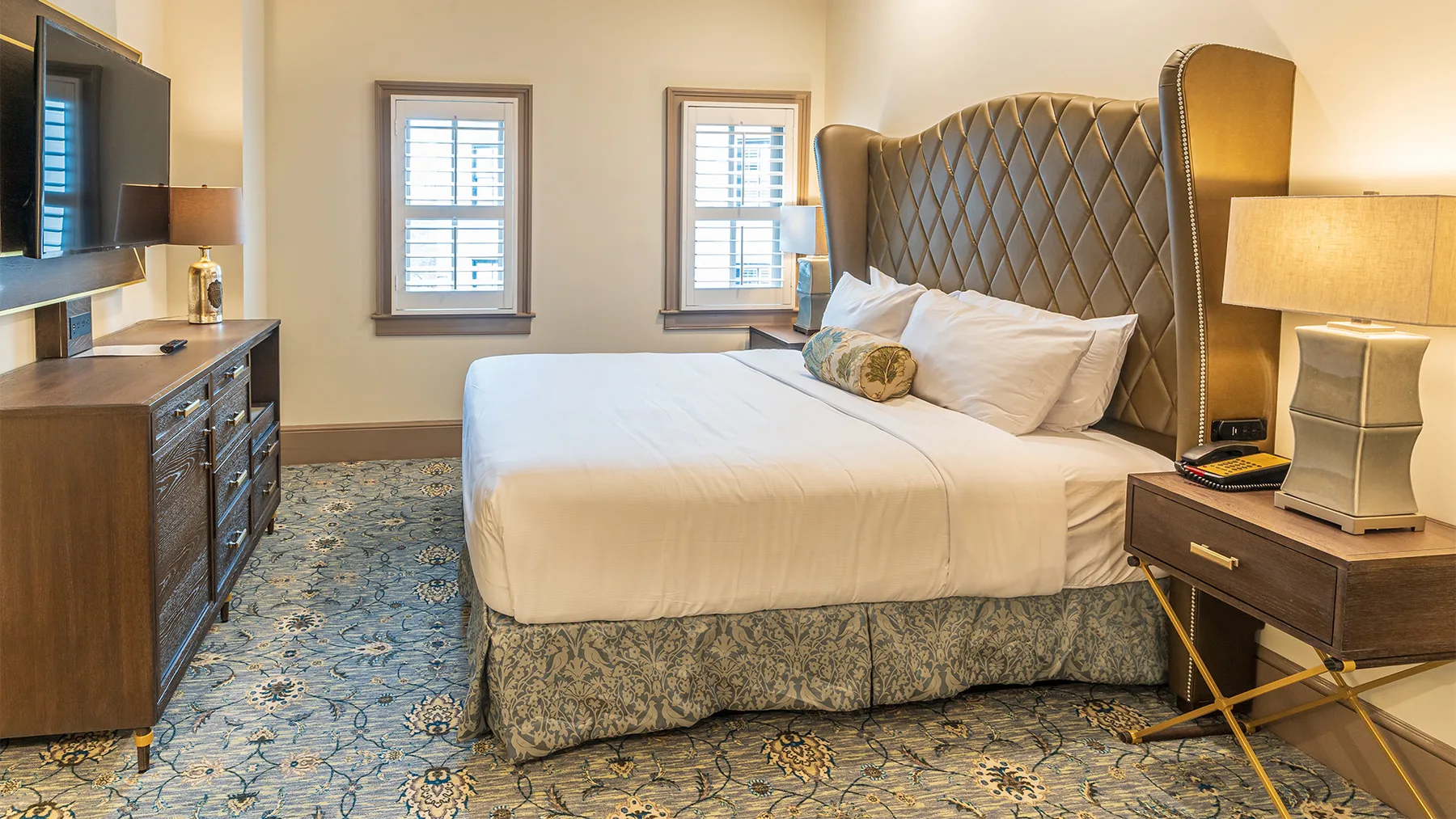 Guest room bed and bedside lamp