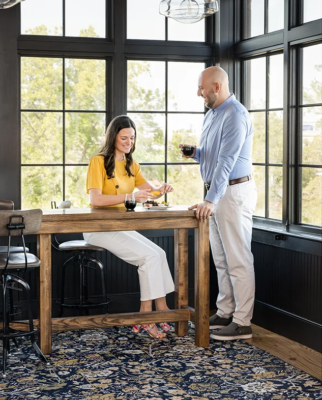 Guests seated at a table with wine
