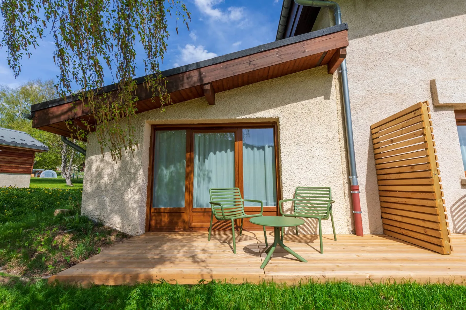 Wooden terrace of a Le Vernay guest room