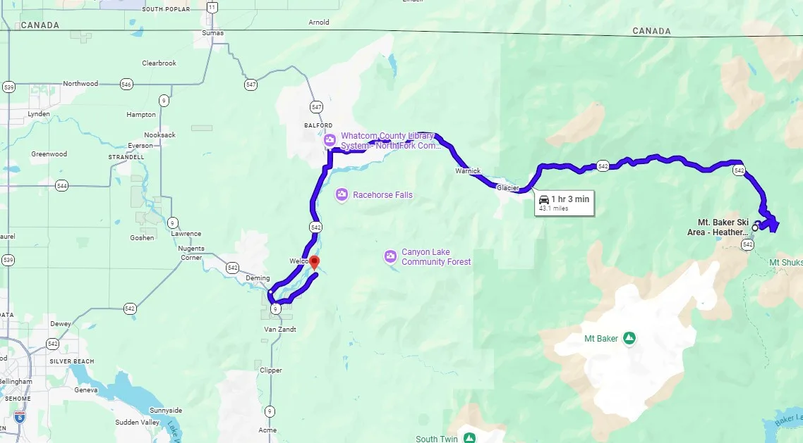 A map shows a blue route winding eastward through a mountainous region.
