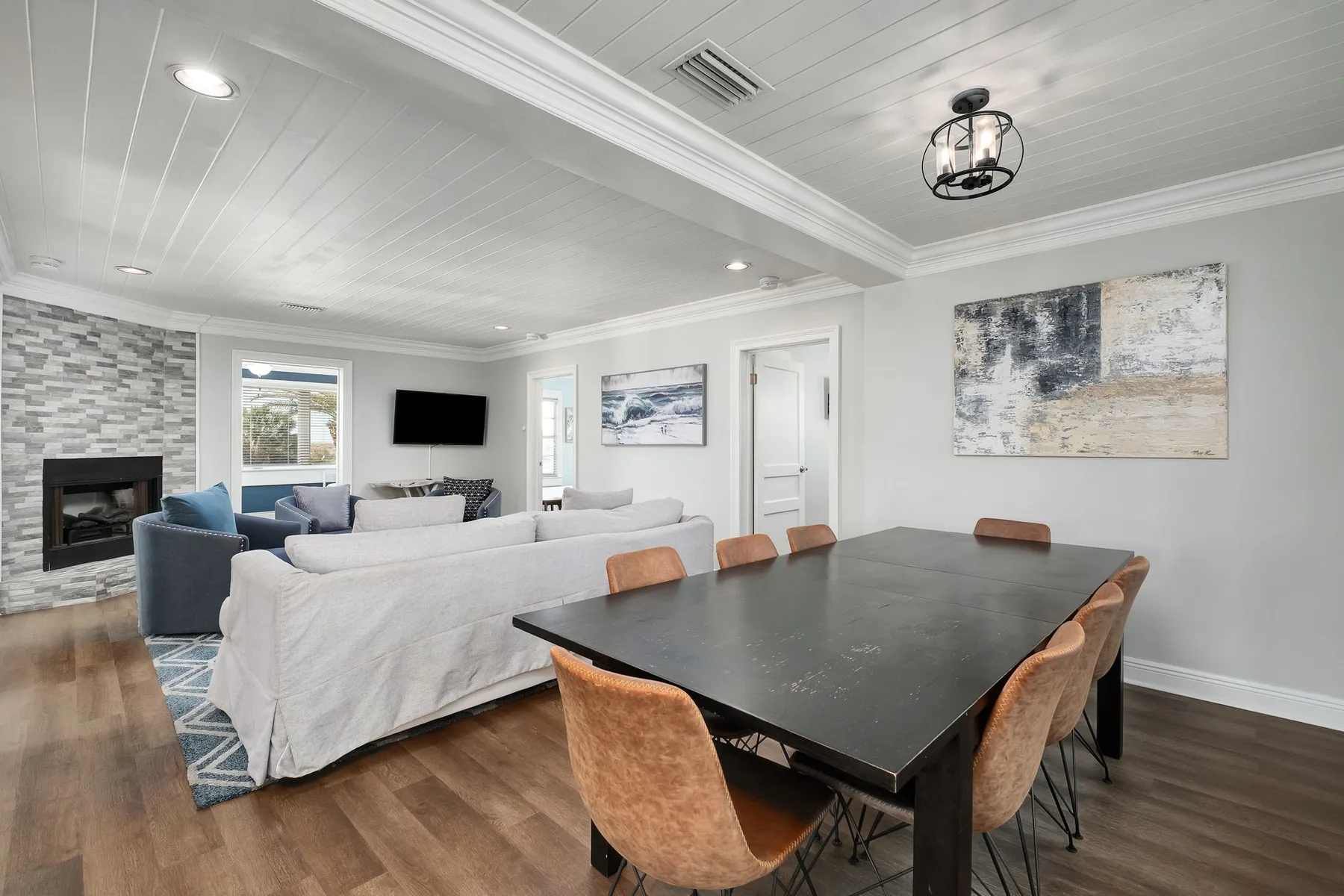 An open living and dining area with a large table and seating.