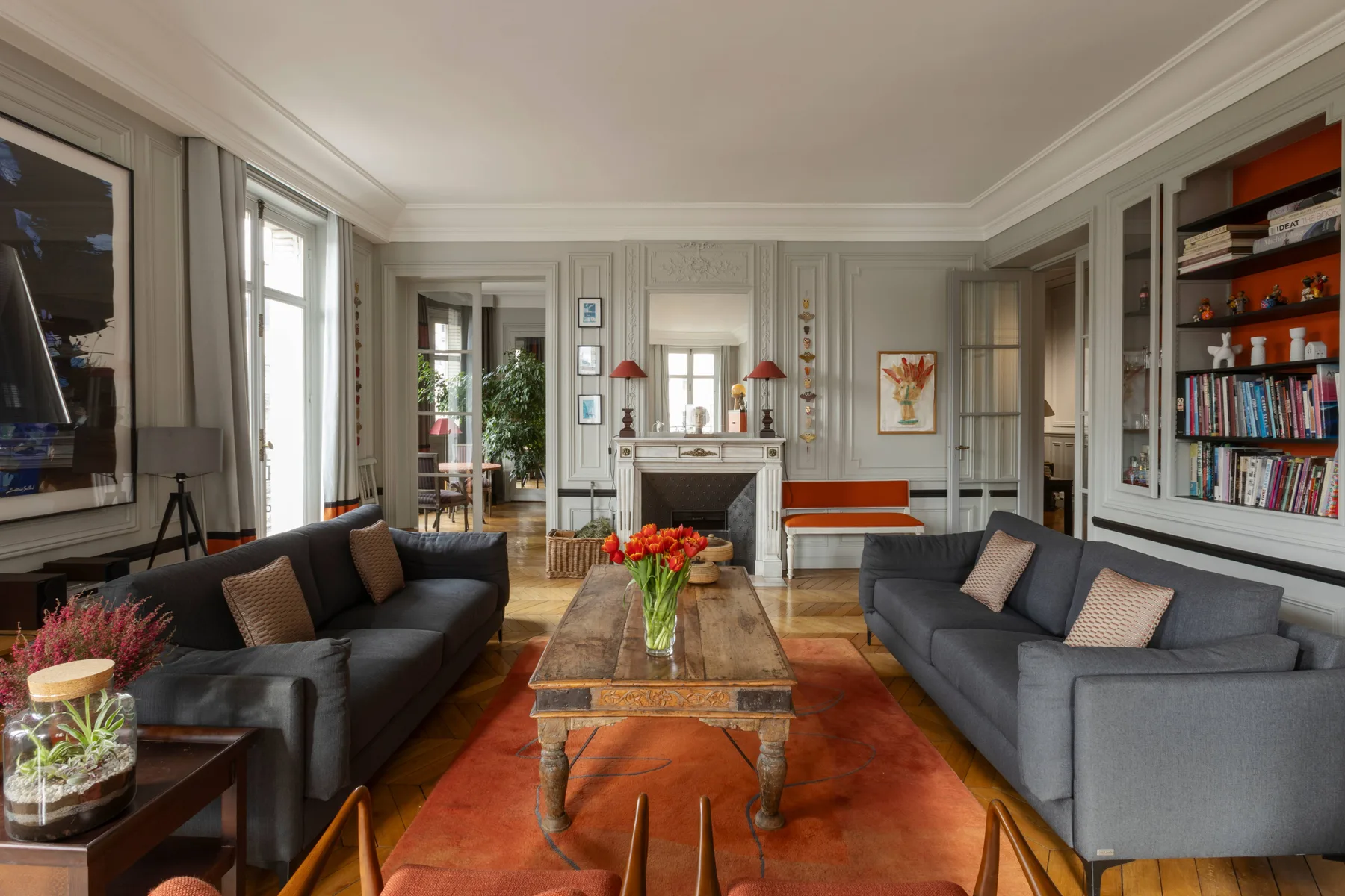 A sitting room with sofas facing a coffee table and fireplace.