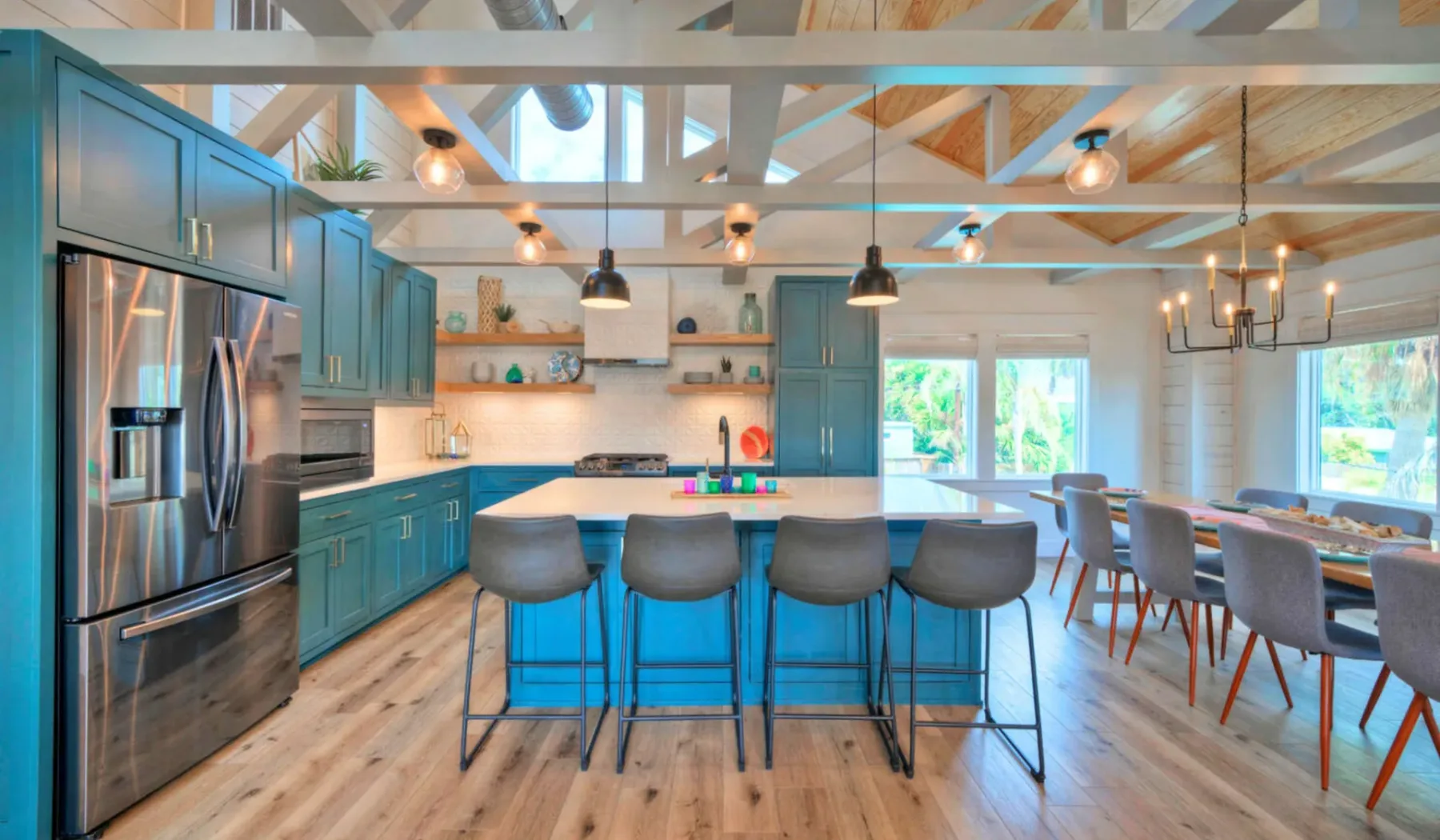 A spacious kitchen and dining area with a central island and seating.