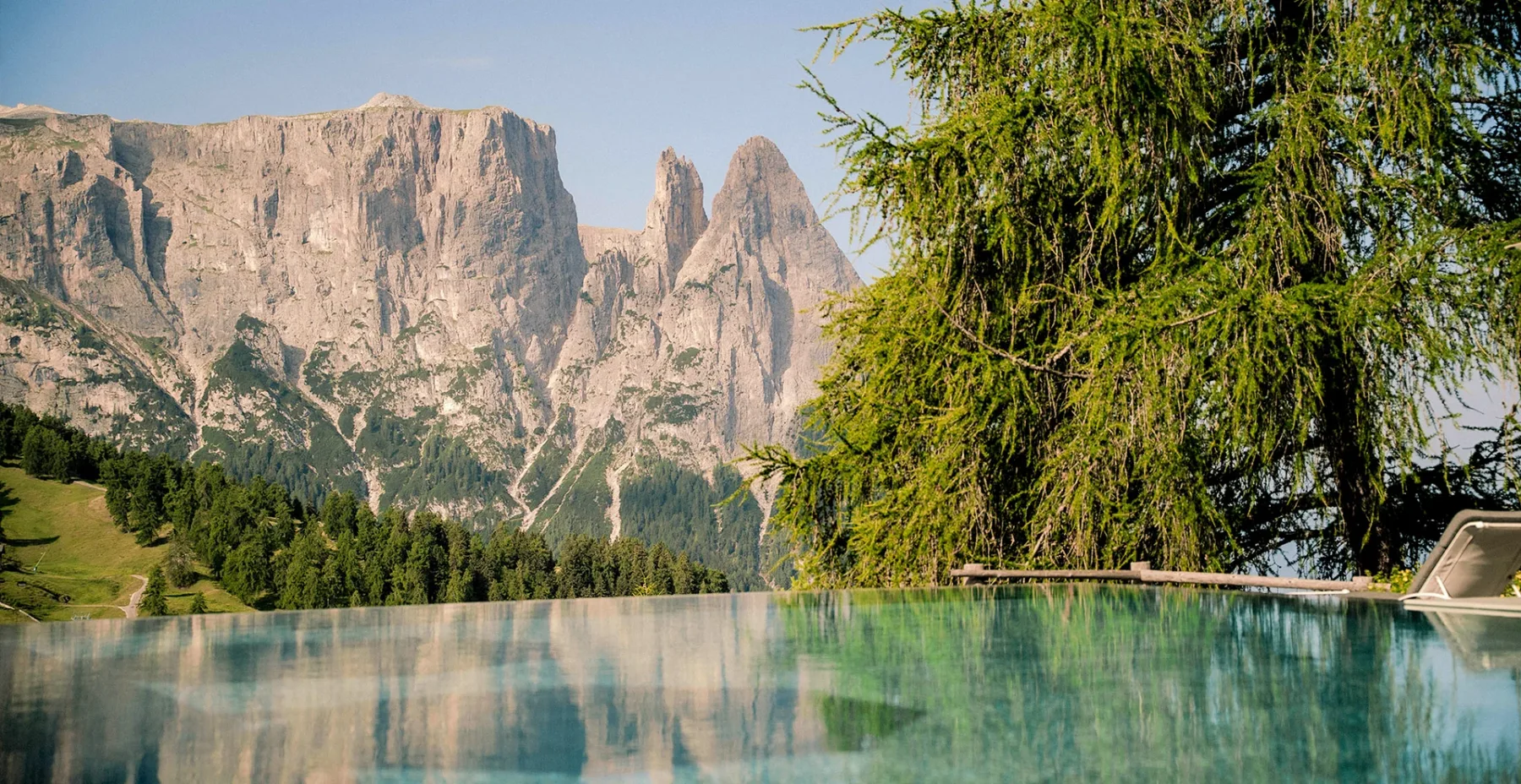 Outdoor infinity pool with mountain views.
