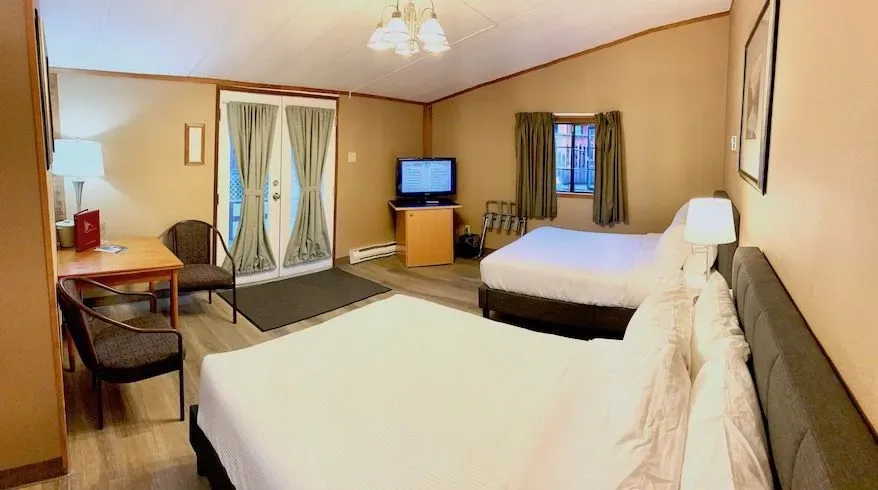 Rocky Mountain Double room with two beds and French doors.