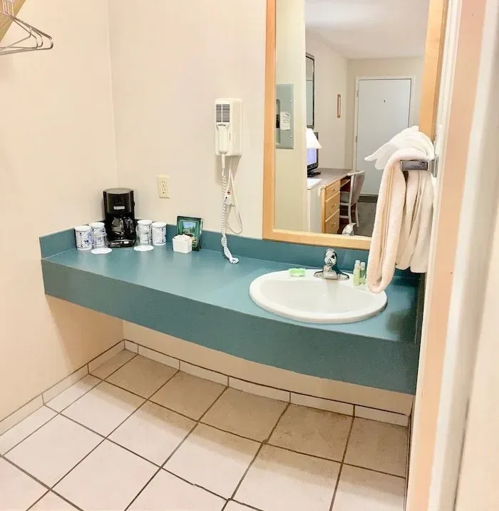Double Lodge bathroom vanity with sink and mirror.
