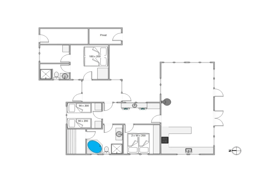 Un plano muestra varias habitaciones, un baño y una amplia zona abierta.