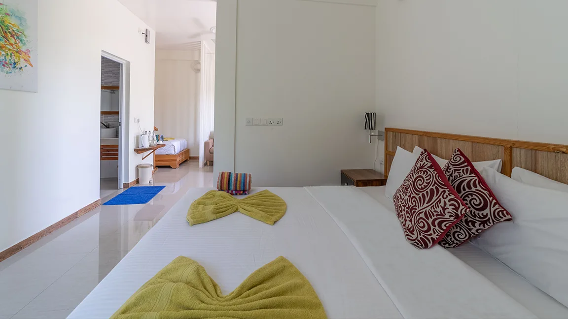 Family room, showing the bed, bathroom and a second living area.