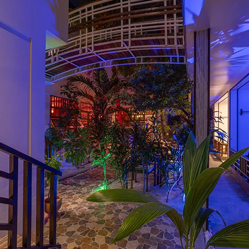 Kamadhoo Inn restaurant garden area at night.