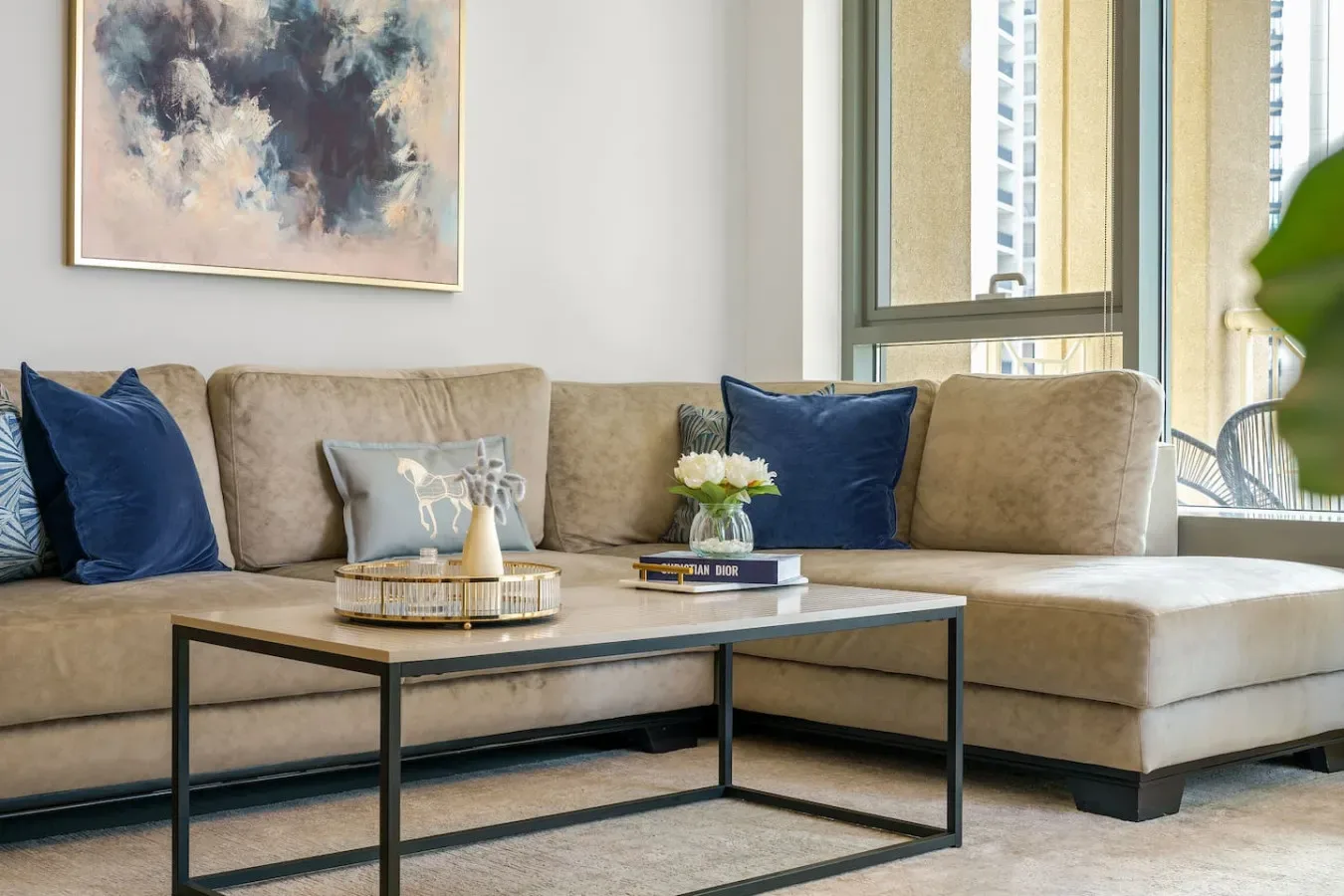 A living room with a sectional seating area and a low coffee table.