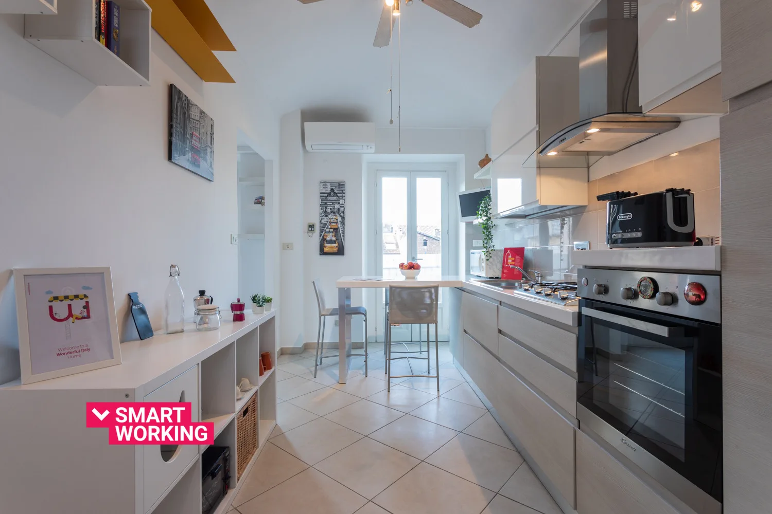 A bright kitchen with a dining counter and built-in oven.