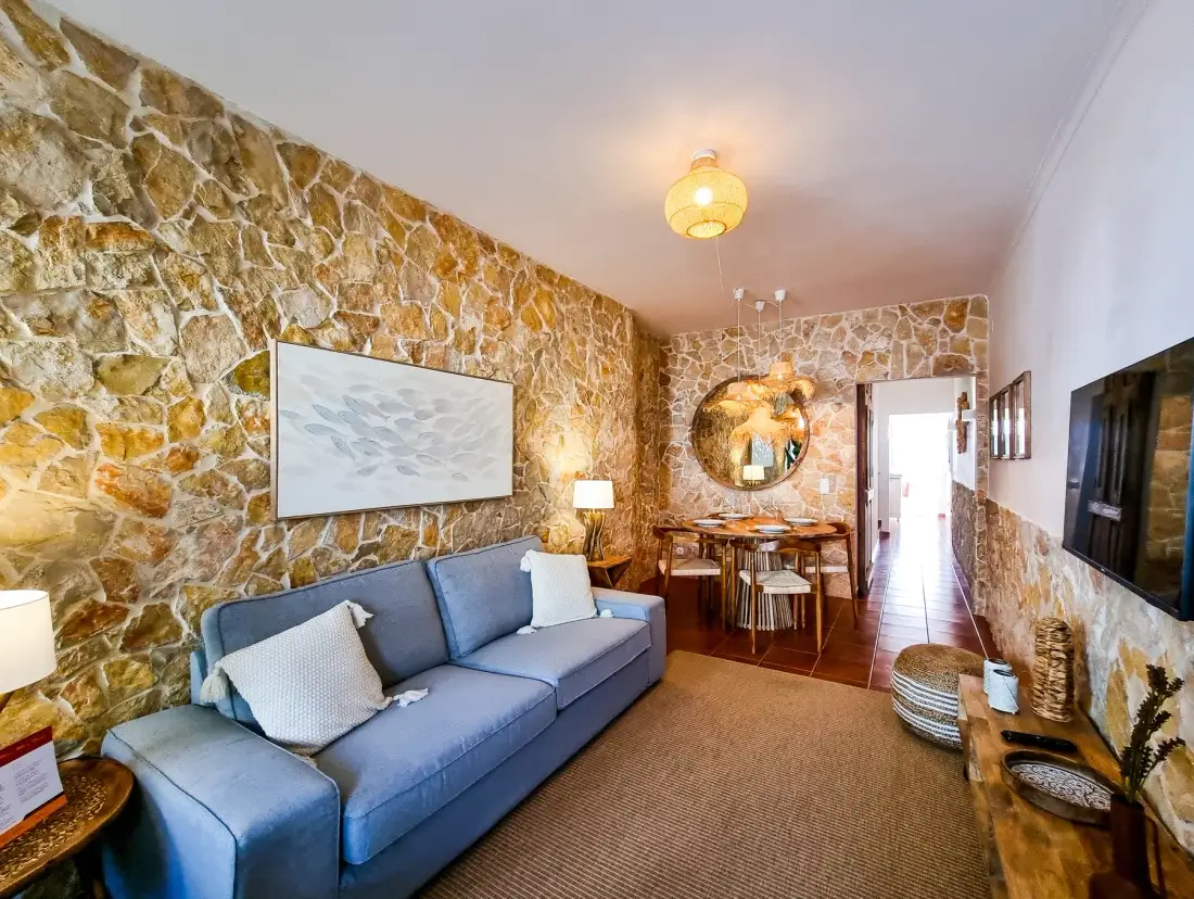 Living room with seating and a dining area.