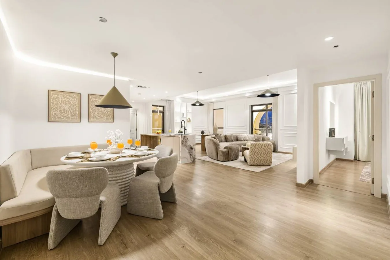 An open-plan dining and living area with a set table and seating.
