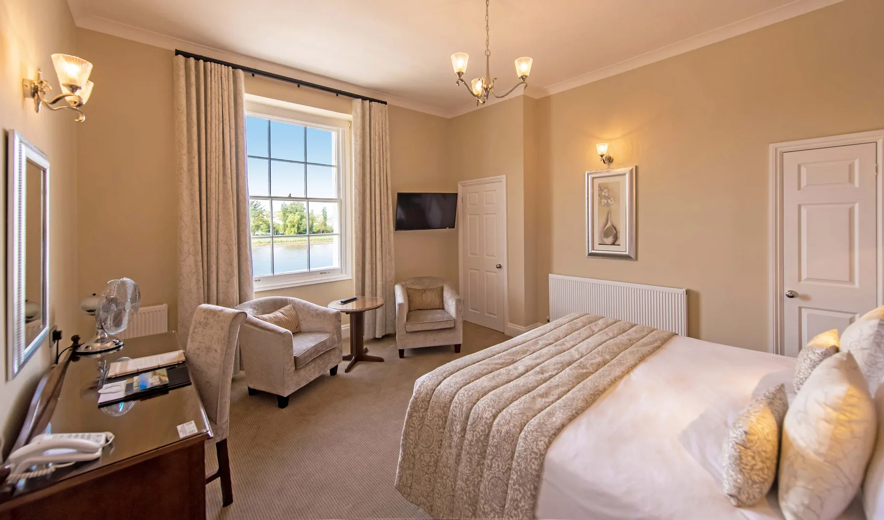 Imperial Hotel annexe bedroom with desk and seating area