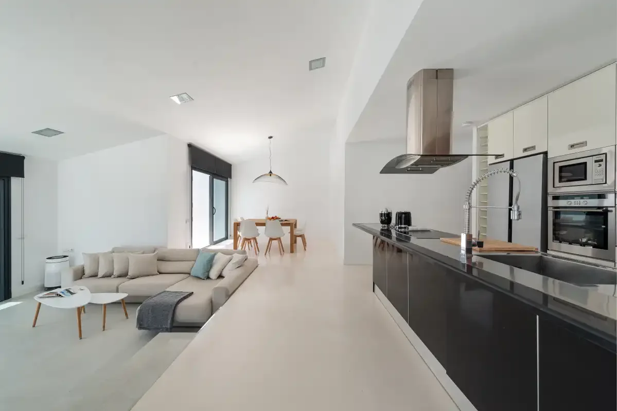 An open-plan living and dining area with a kitchen island.
