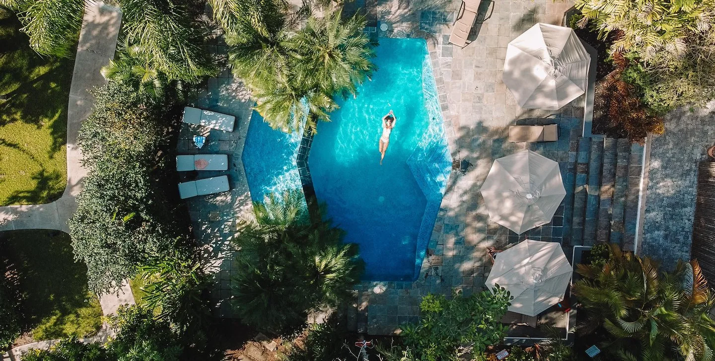 Aerial view of the resort pool surrounded by greenery