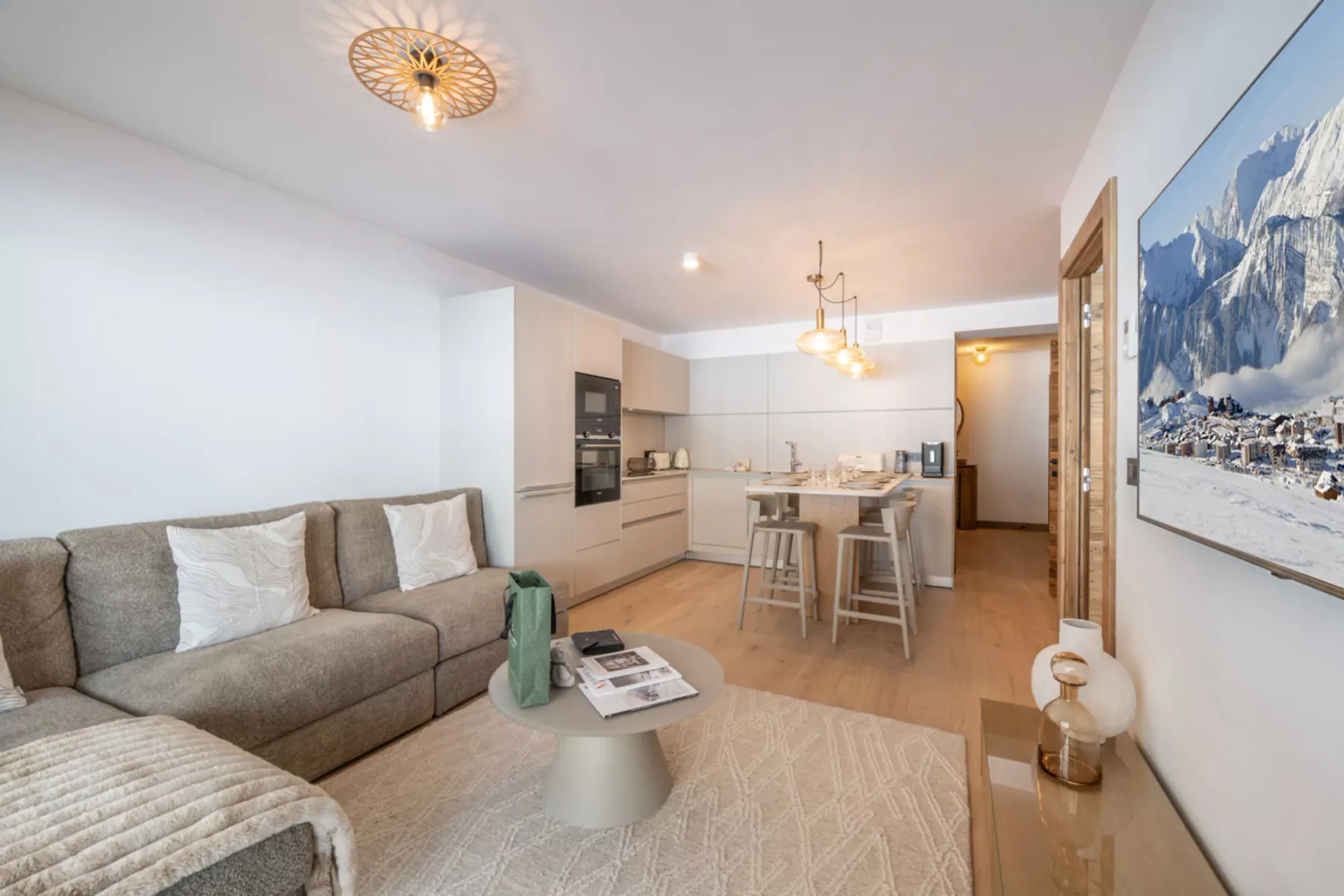 A living room opens into a dining area and kitchen.