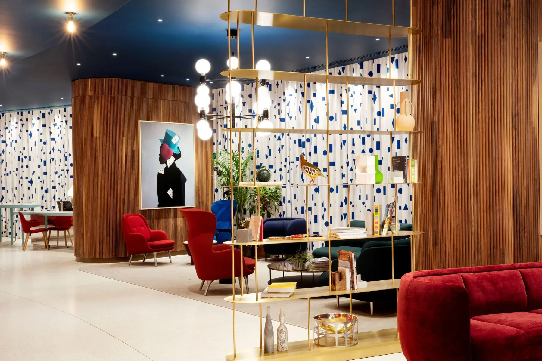 Hotel lobby lounge with contemporary seating and artwork.
