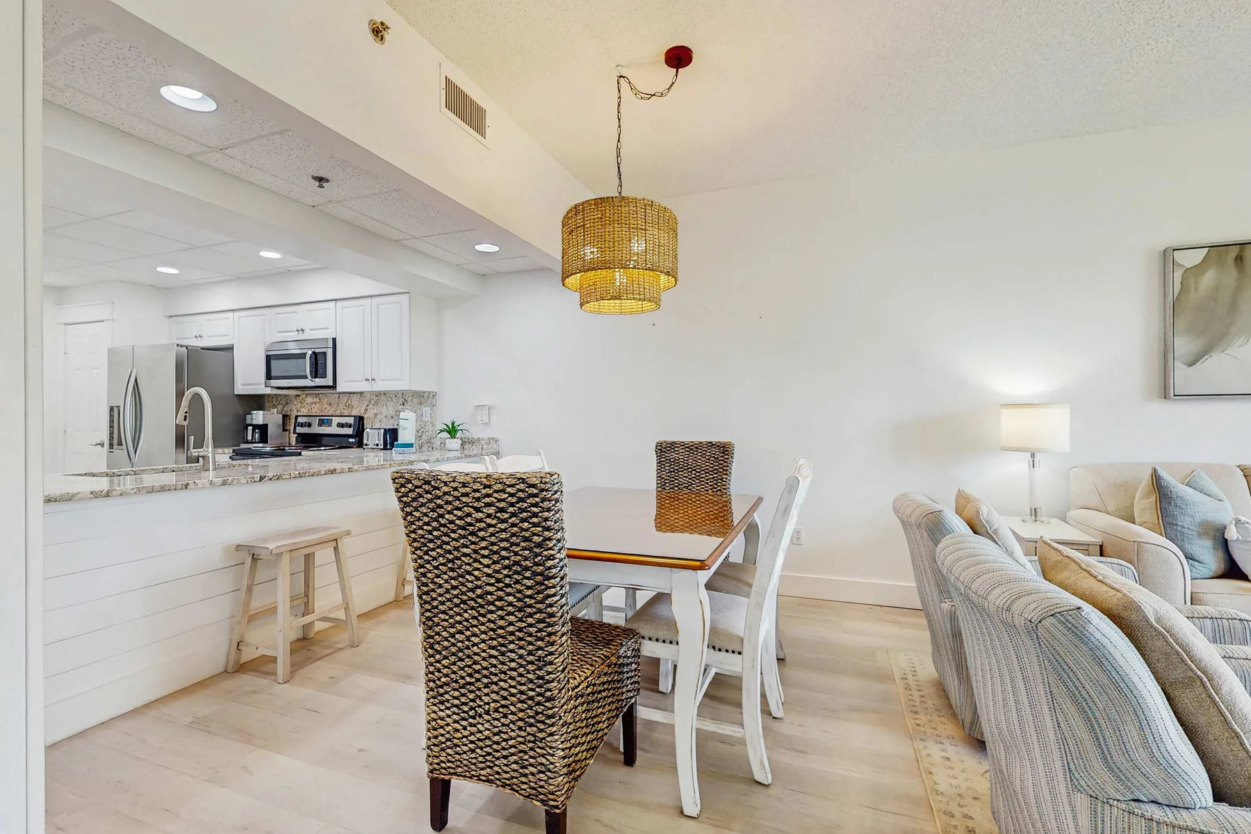 An open-plan kitchen and dining area with a table beside the kitchen counter.