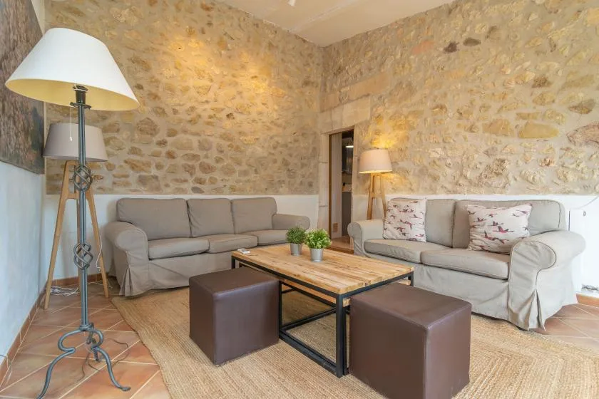 A living room with seating arranged around a low coffee table.