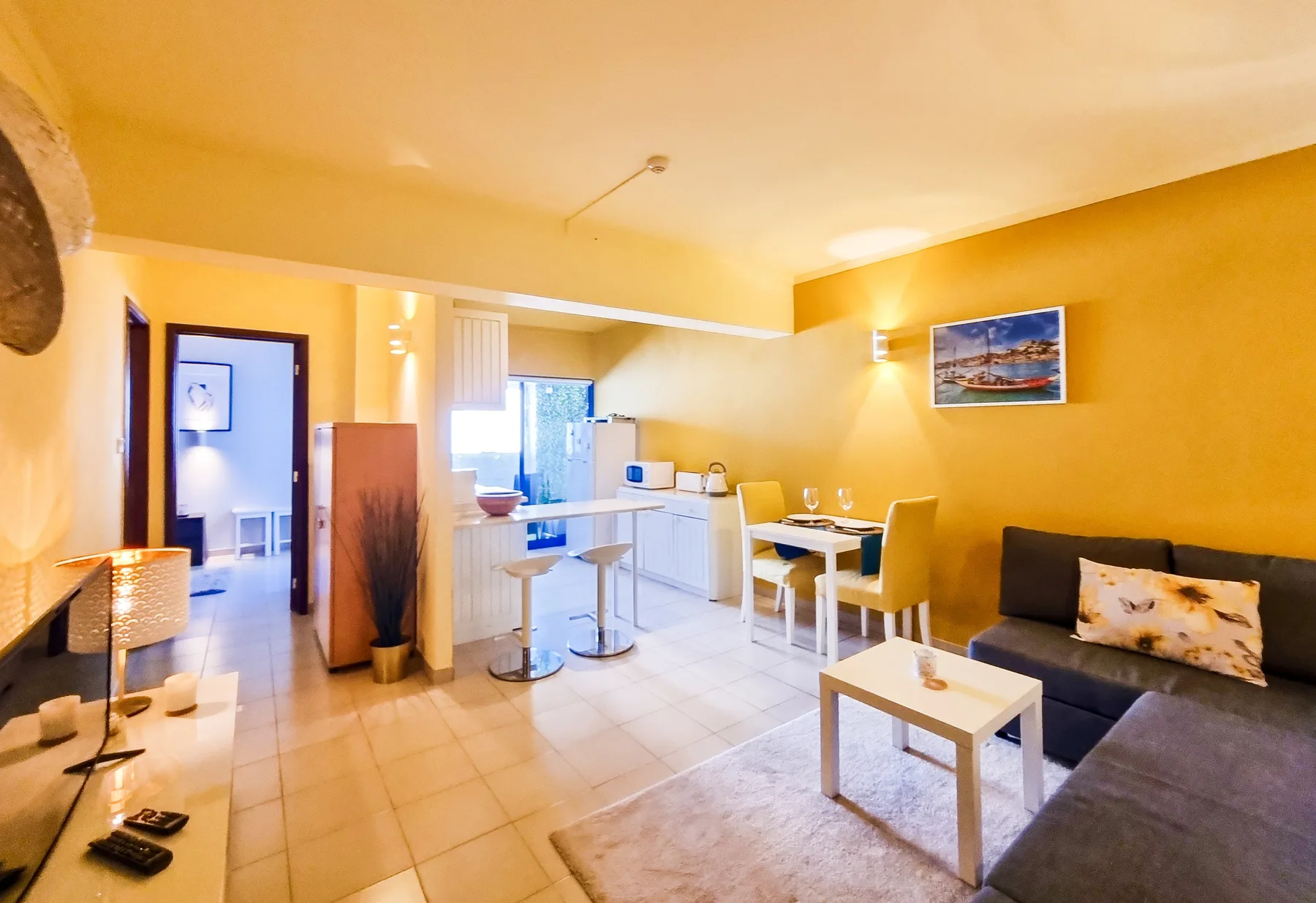 Living room with a dining area and kitchenette.