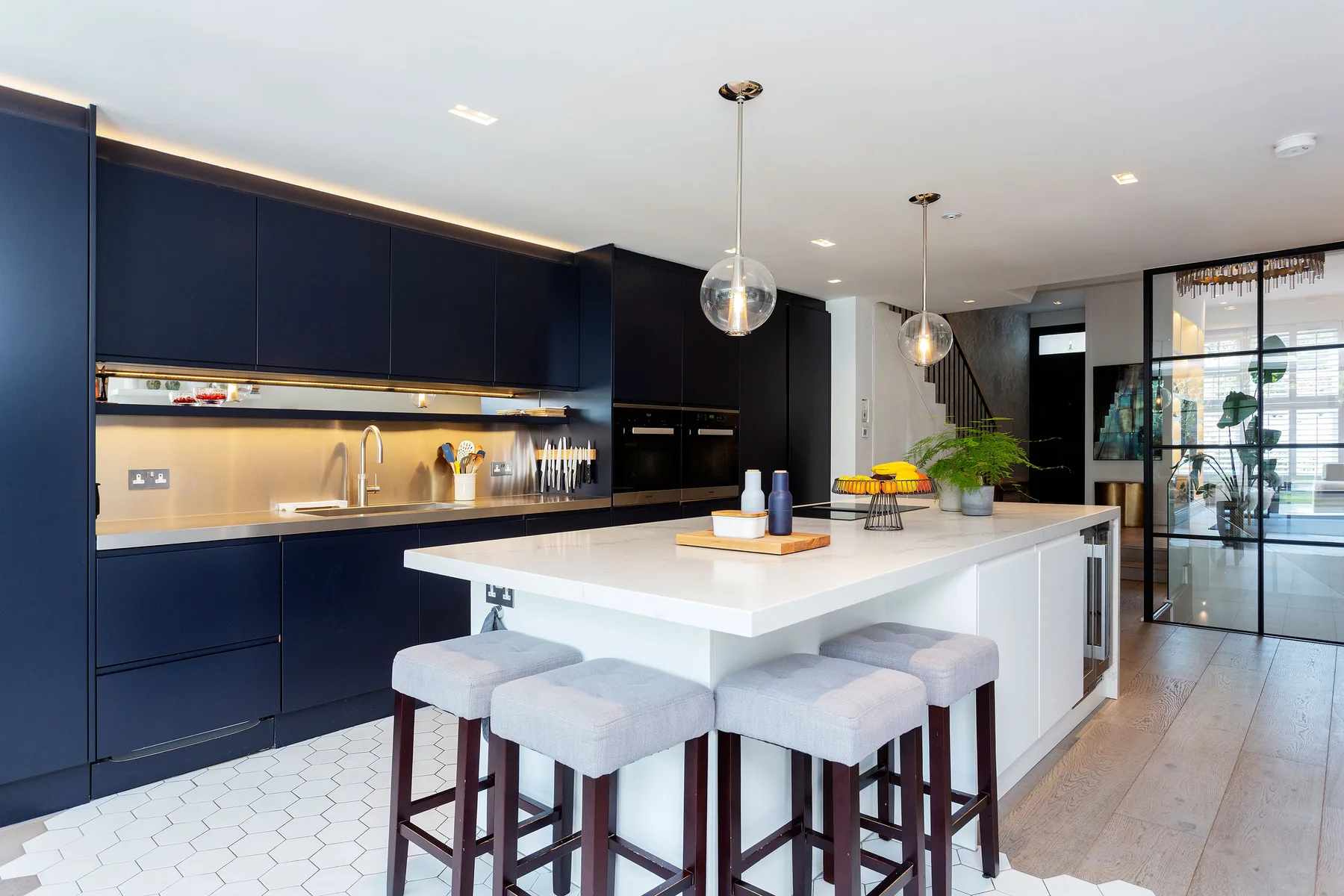 Modern kitchen with a large island and bar seating.