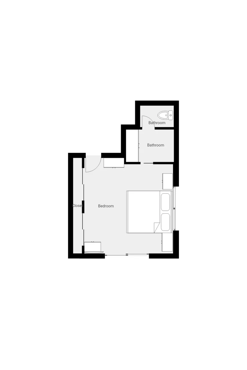 Un plano muestra un dormitorio con un baño contiguo.