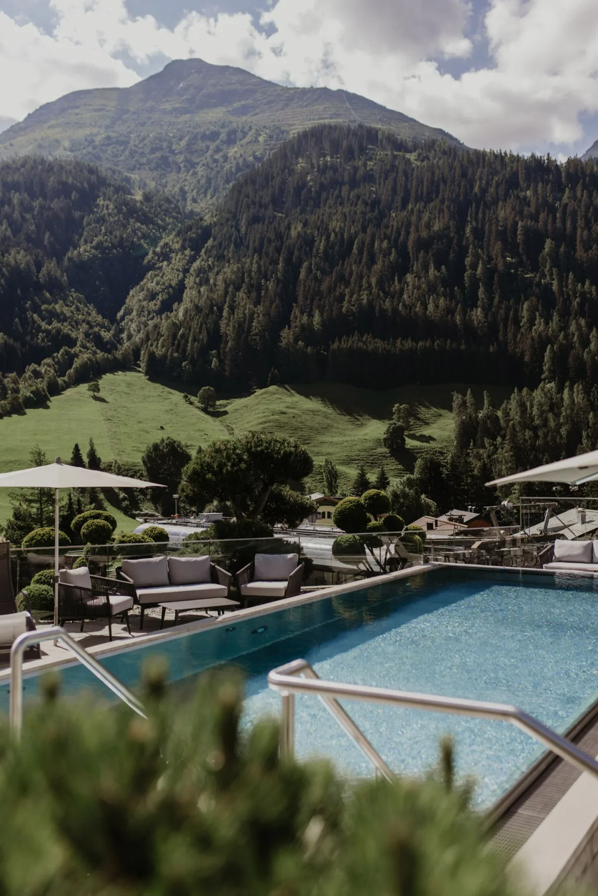 Rooftop pool lounge with mountain views