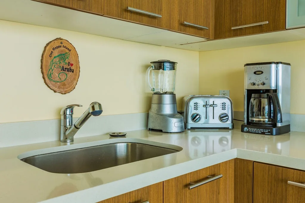 Your fully equipped kitchen features modern appliances including a blender, toaster, and coffee maker, perfect for preparing your favorite meals and morning brew.