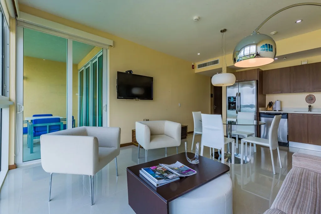 Step into your stylish open-plan space where contemporary design meets comfort—relax in the airy living room, gather at your dining table, or whip up meals in your sleek kitchen.