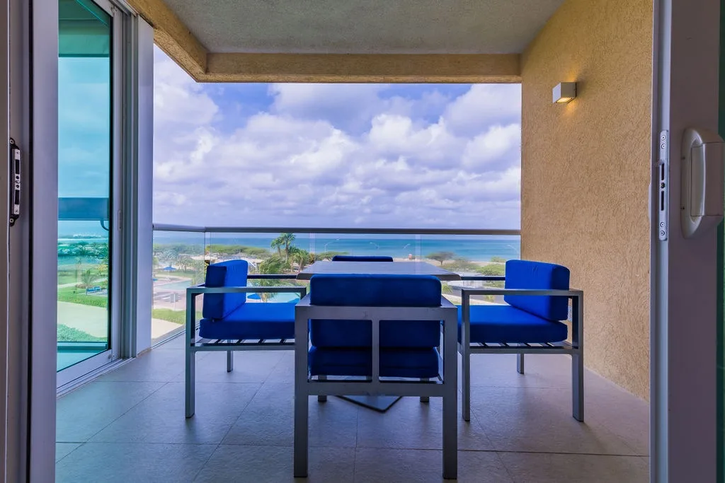 Step onto your private balcony and soak in sweeping ocean views. With stylish seating and endless sky, it's your perfect spot to relax and unwind.