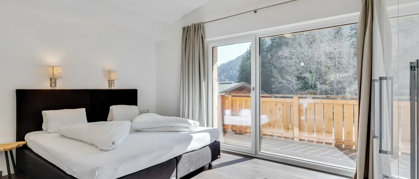 Room with double bed and terrace overlooking the mountains