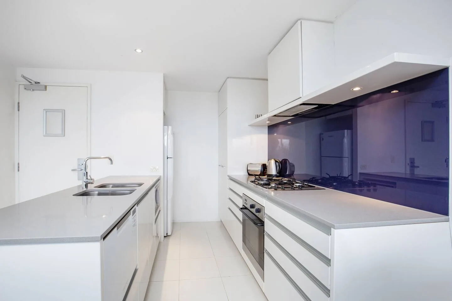 The kitchen is fully equipped for meals at home with an oven, stove, microwave and dishwasher for easy clean-up.