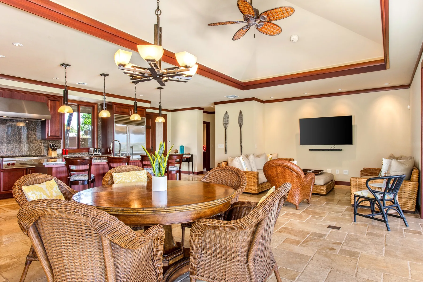 An open dining and living area with a round table and seating.