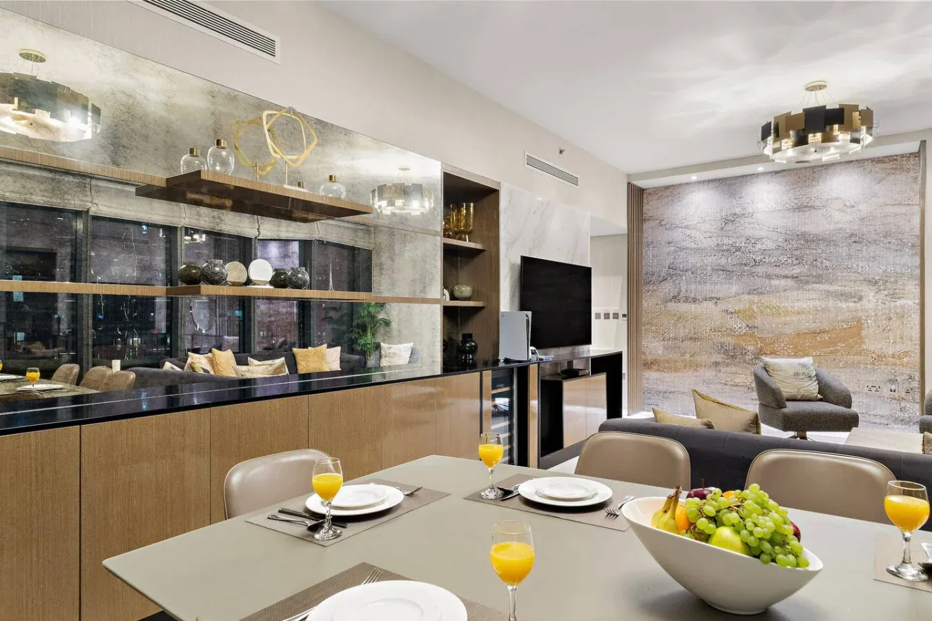 A dining area with a table set beside a glass-fronted display cabinet.