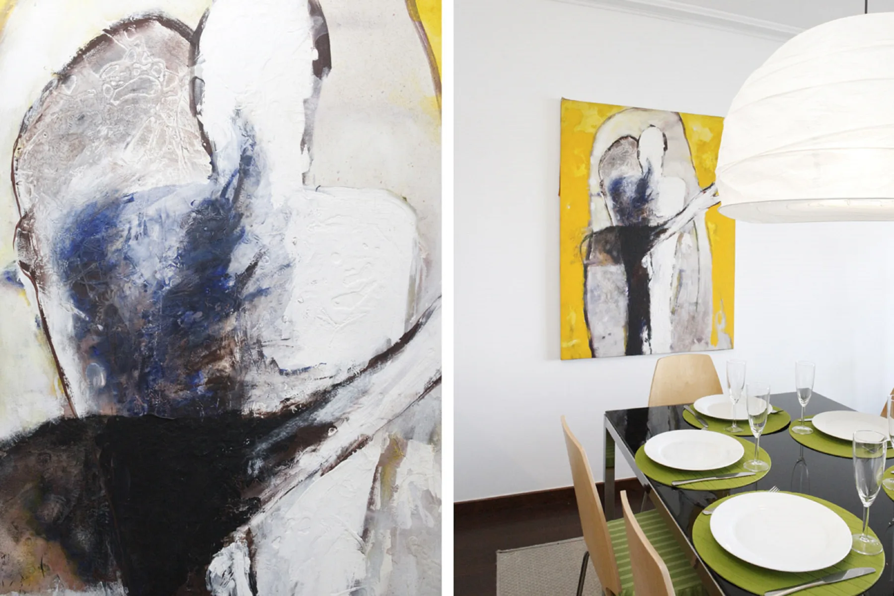 A dining area with a set table and abstract artwork on the wall.
