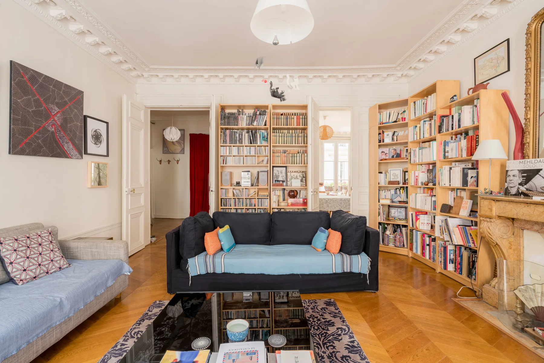 A living room with bookshelves, two sofas, and a coffee table.