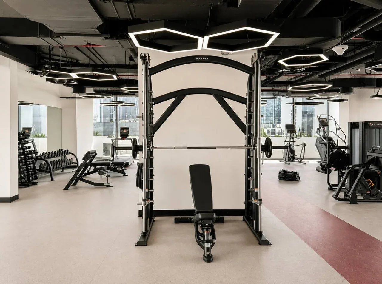 A spacious gym with weight machines and exercise equipment.