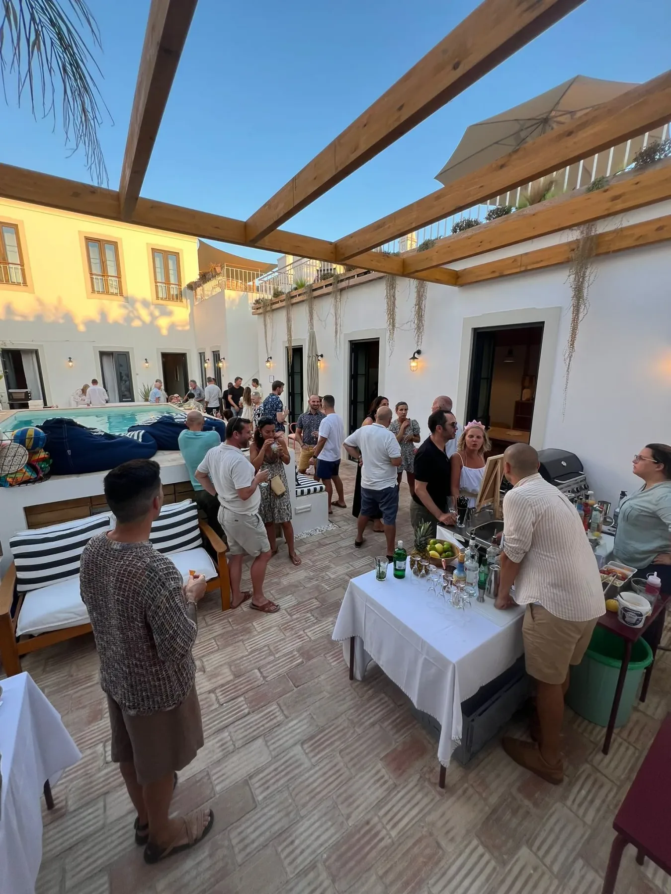 Guests gathered around tables on the patio.
