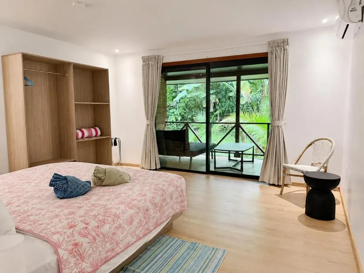 Current Rainforest Balcony Suite opening onto its private balcony