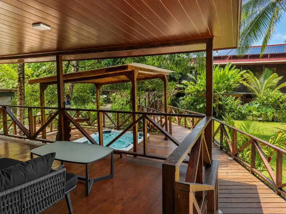 The jacuzzi and pool deck among the gardens