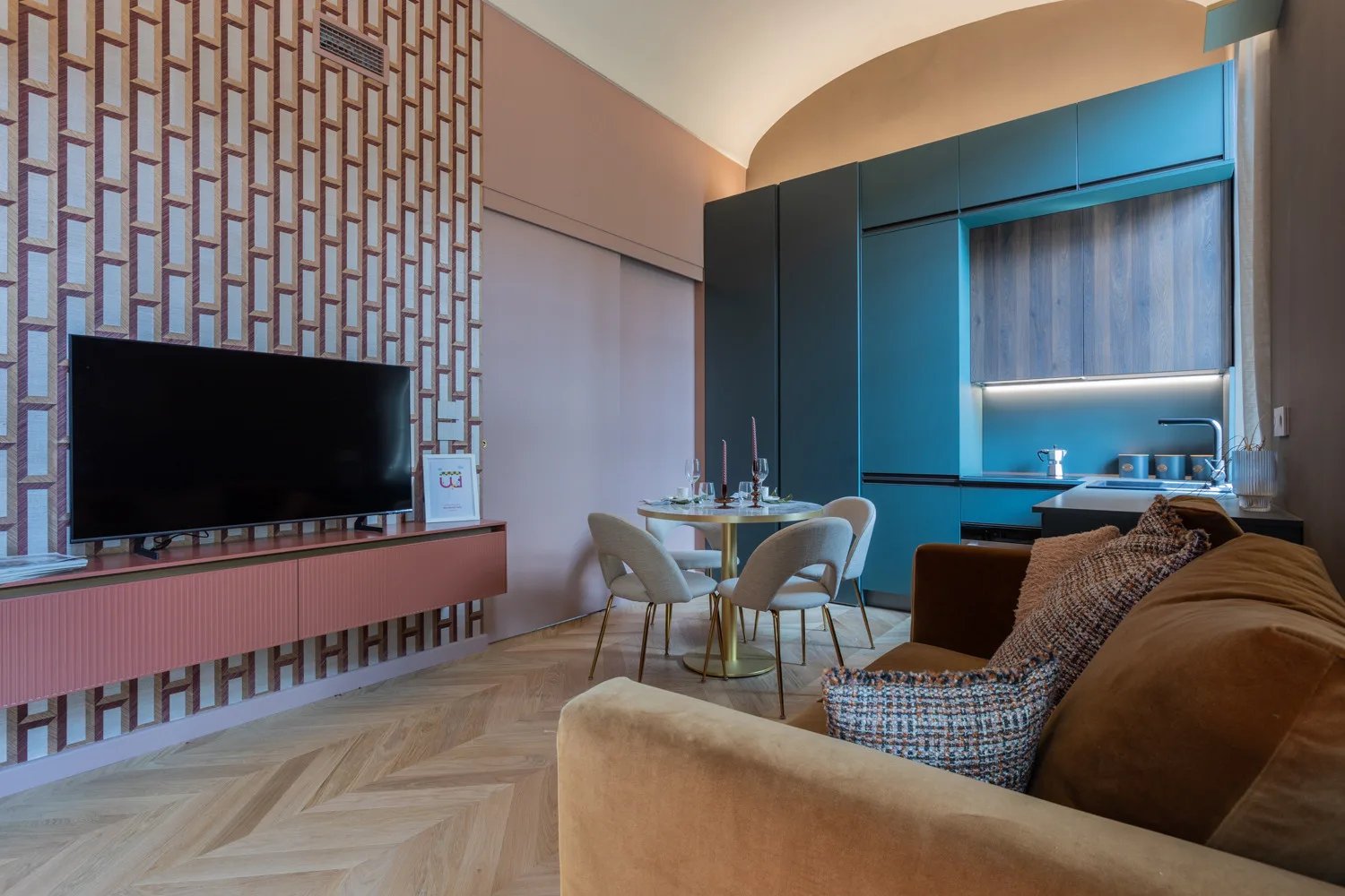 A living and dining area with a television, dining table, and seating.