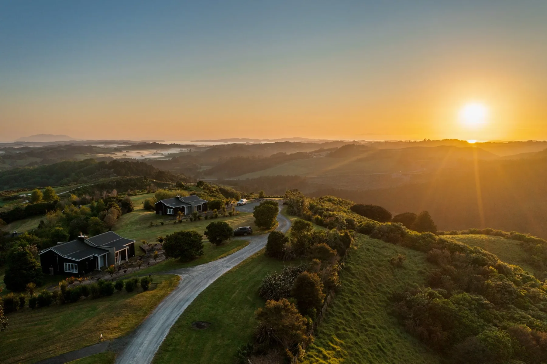 Sunset over Woodhouse Mountain Lodge and the surrounding countryside.