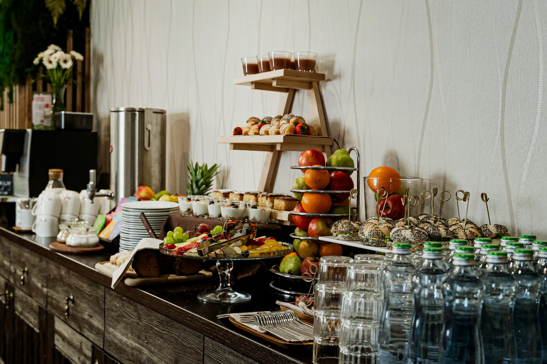 Breakfast buffet with fruit and desserts.