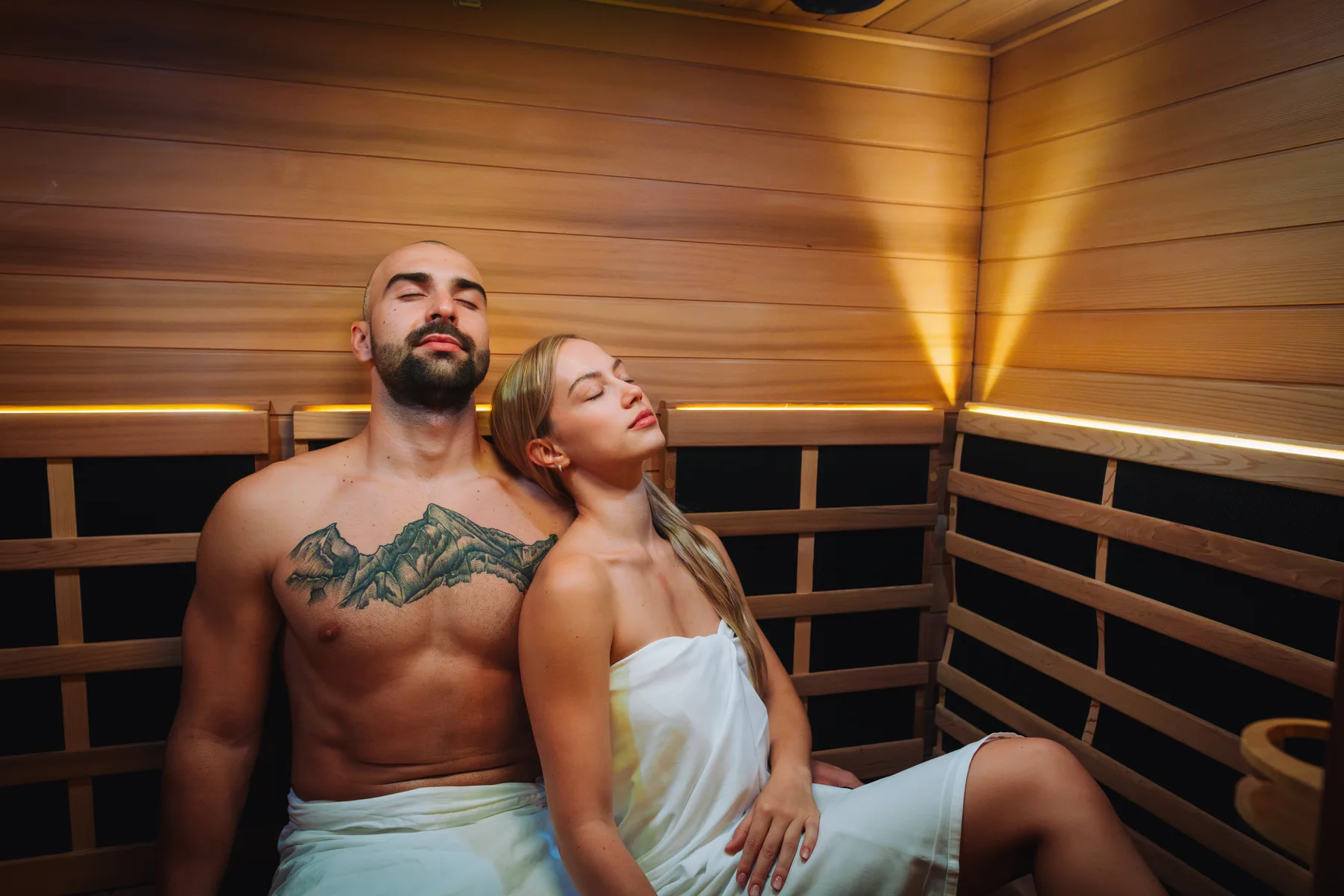 Guests relaxing in a wooden sauna.
