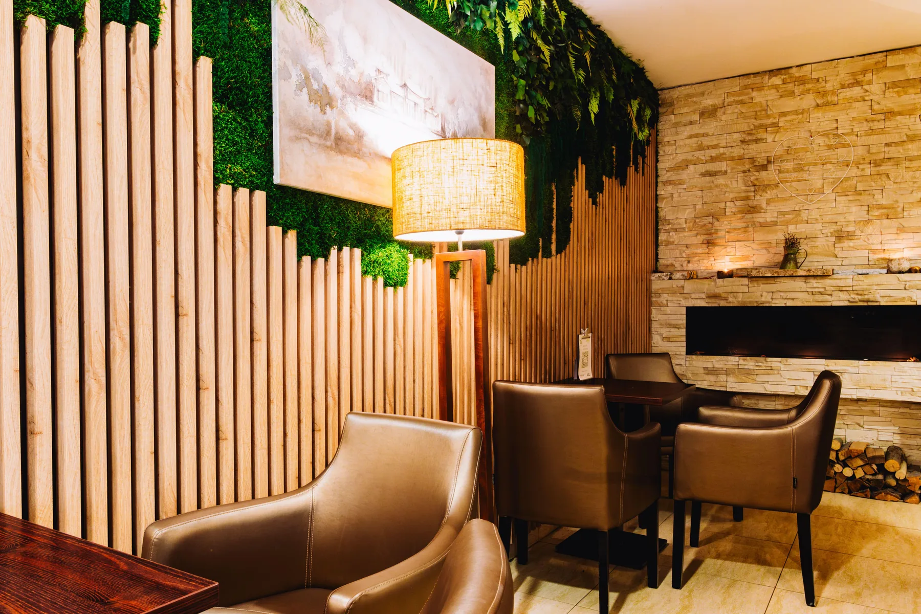 Hotel lounge with leather armchairs and ambient lighting.