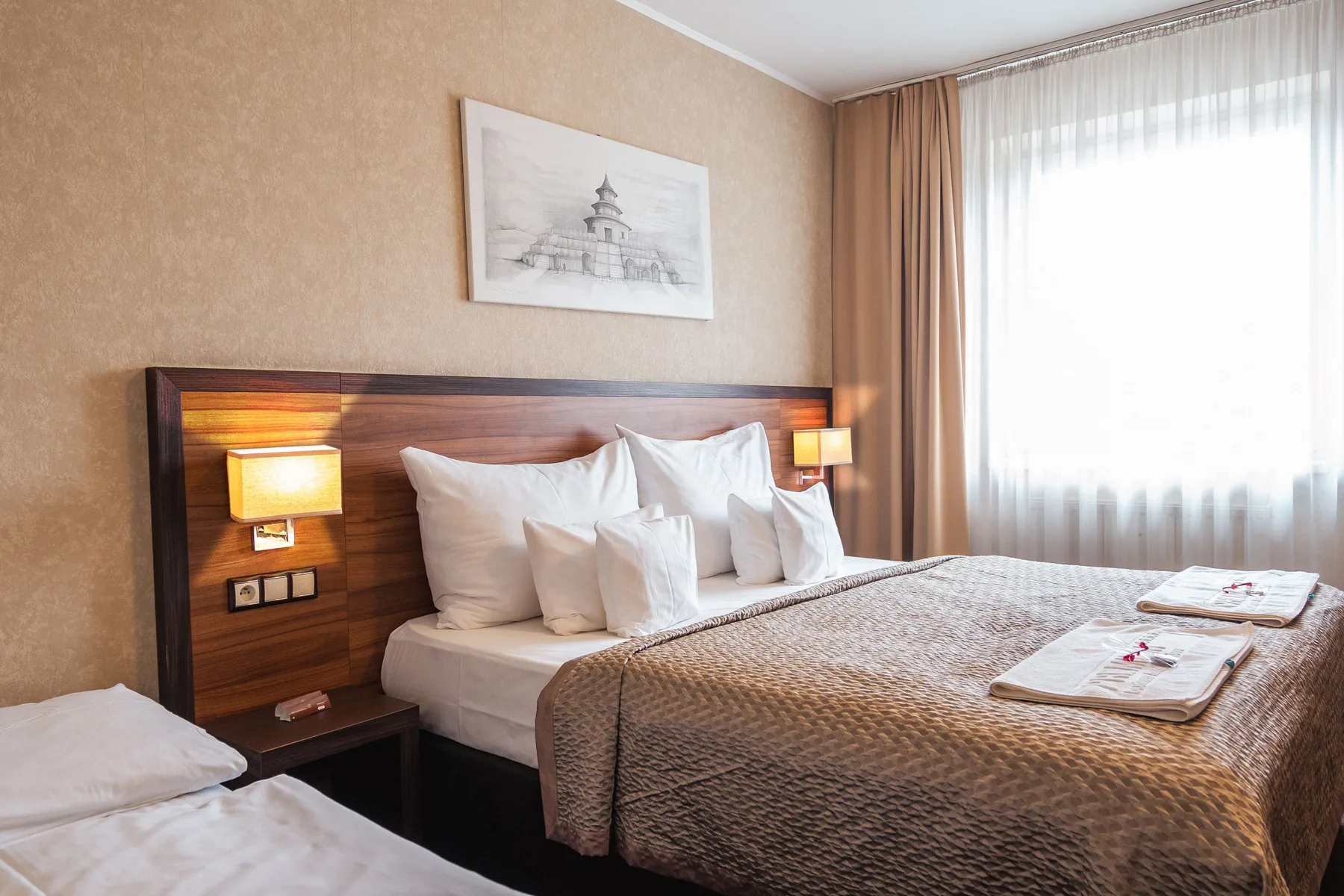 Hotel room with a double bed and the option of an extra bed.