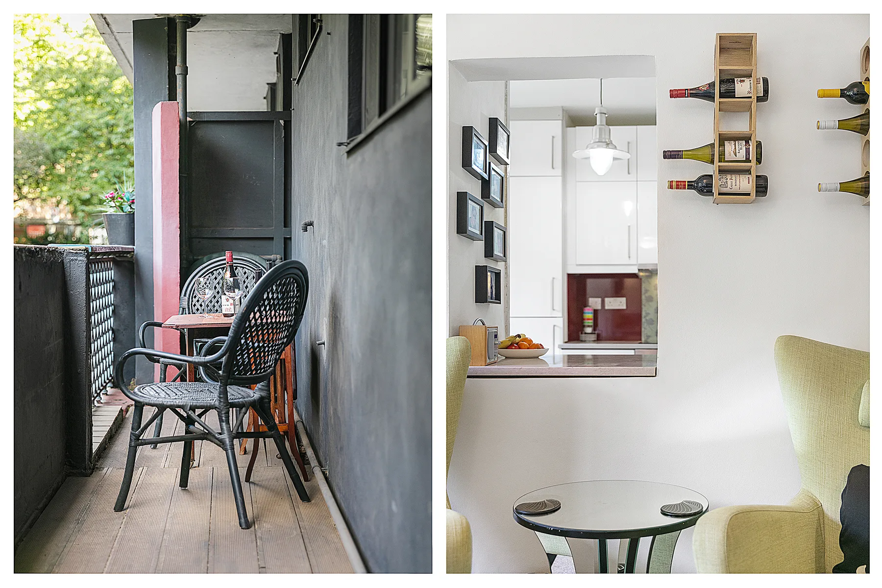 A narrow balcony with black seating and a small table overlooks leafy greenery.