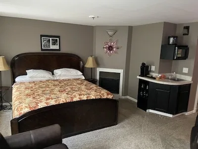 Room 2 bed and fireplace