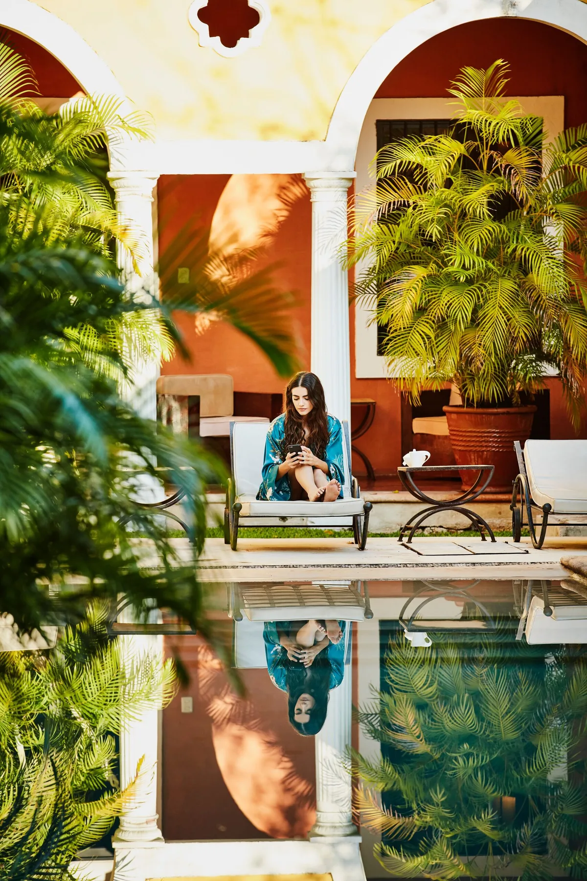 Fashion editorial beside the courtyard pool at Hotel Hacienda Mérida
